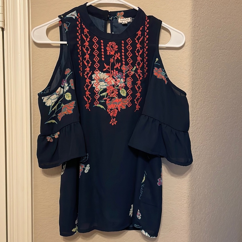 Super cute top, I’m just not a fan of the buttons on the back of the neck